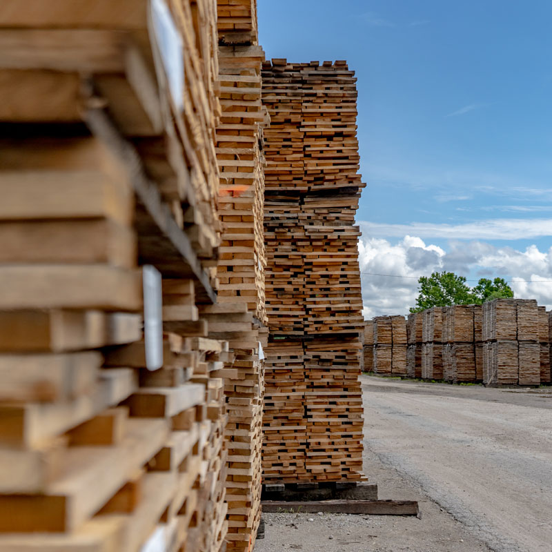 Dry kiln and kiln dried lumber of pallet wood on lot